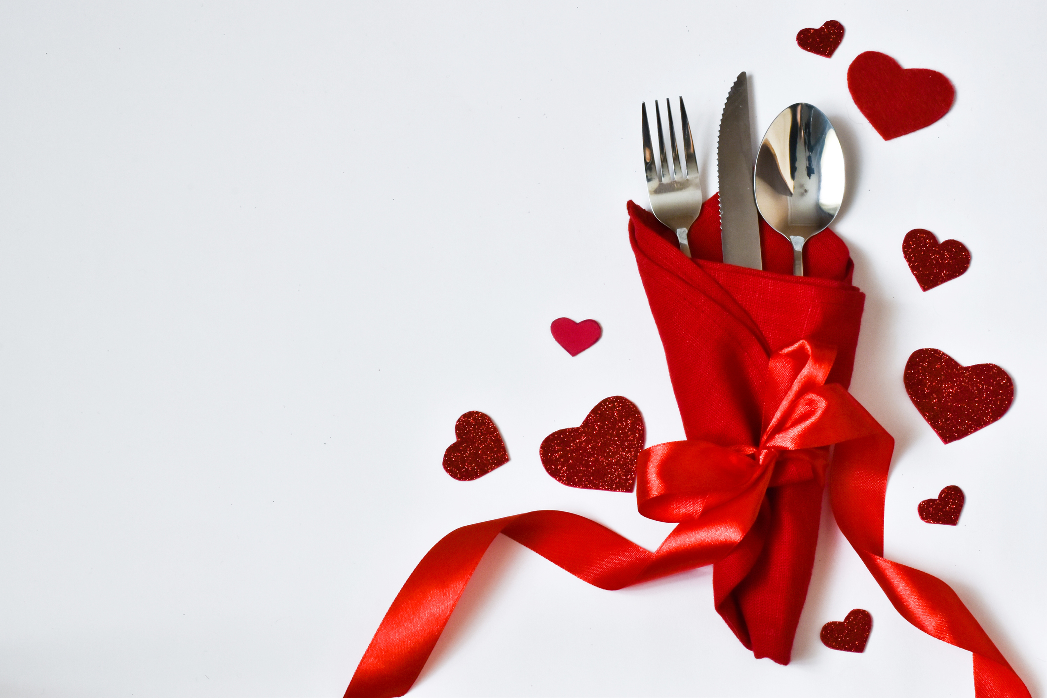 Day. table place setting and cutlery, napkin with red hearts for Valentine day. Holiday concept. Valentine's Day card. Menu for the valentine's Day.