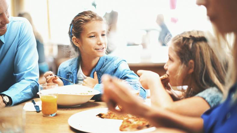 Family having lunch in a restaurant.